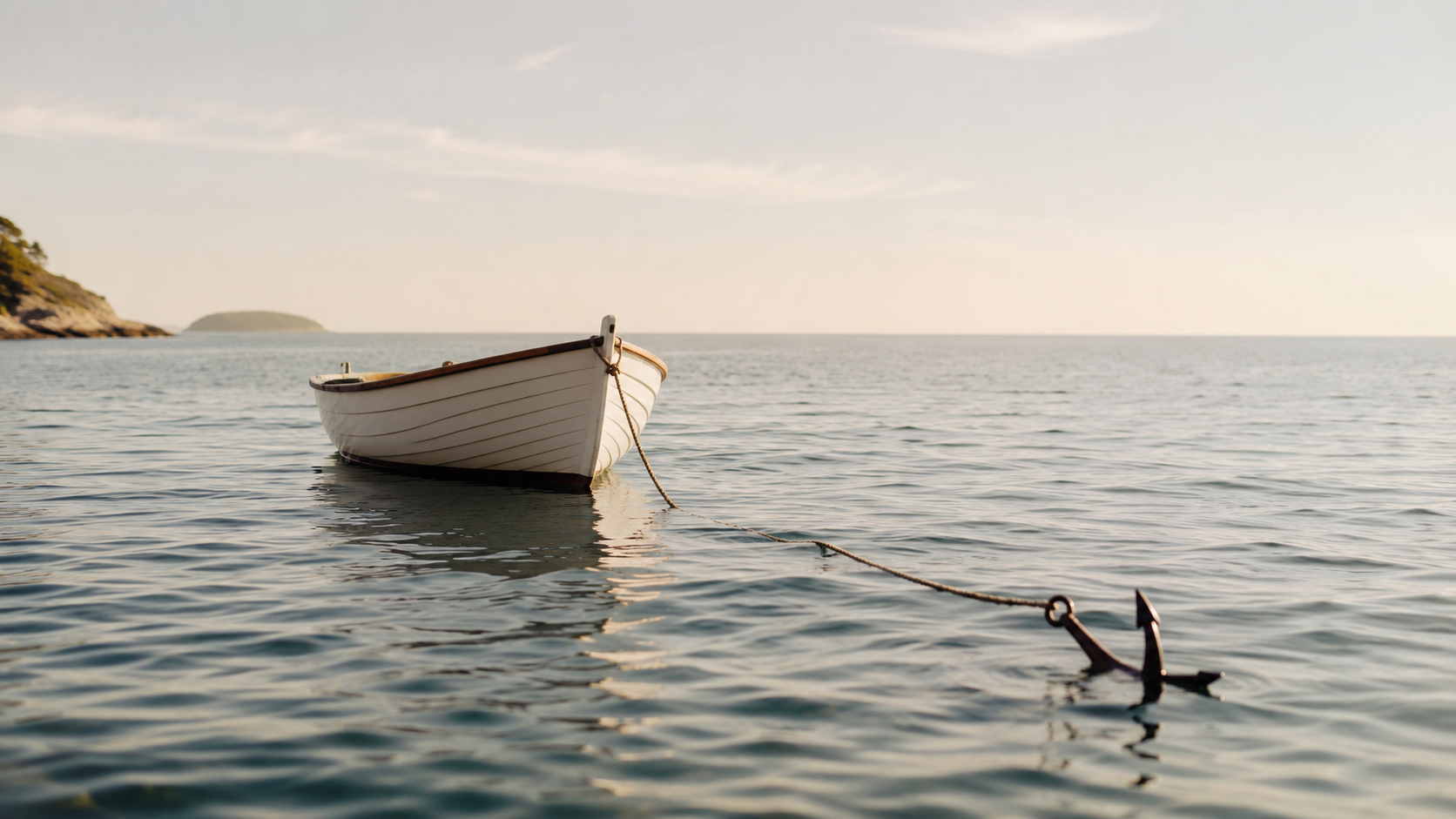 A small boat held steady by an anchor in calm water, symbolizing financial stability and a cash cushion for a service-based business.